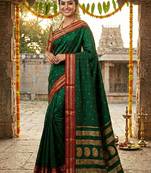 The emerald empress: dark green soft silk saree with rich crimson red zari border