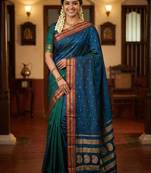 The peacock hue: teal blue soft silk saree with contrast red zari border