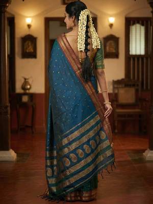 The peacock hue: teal blue soft silk blend saree with contrast red zari border 2