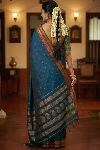 The peacock hue: teal blue soft silk blend saree with contrast red zari border