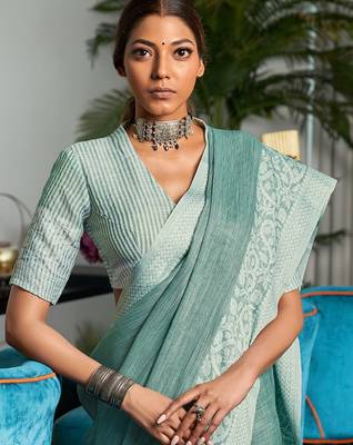 Women teal green & silver-toned woven design linen blend saree 4
