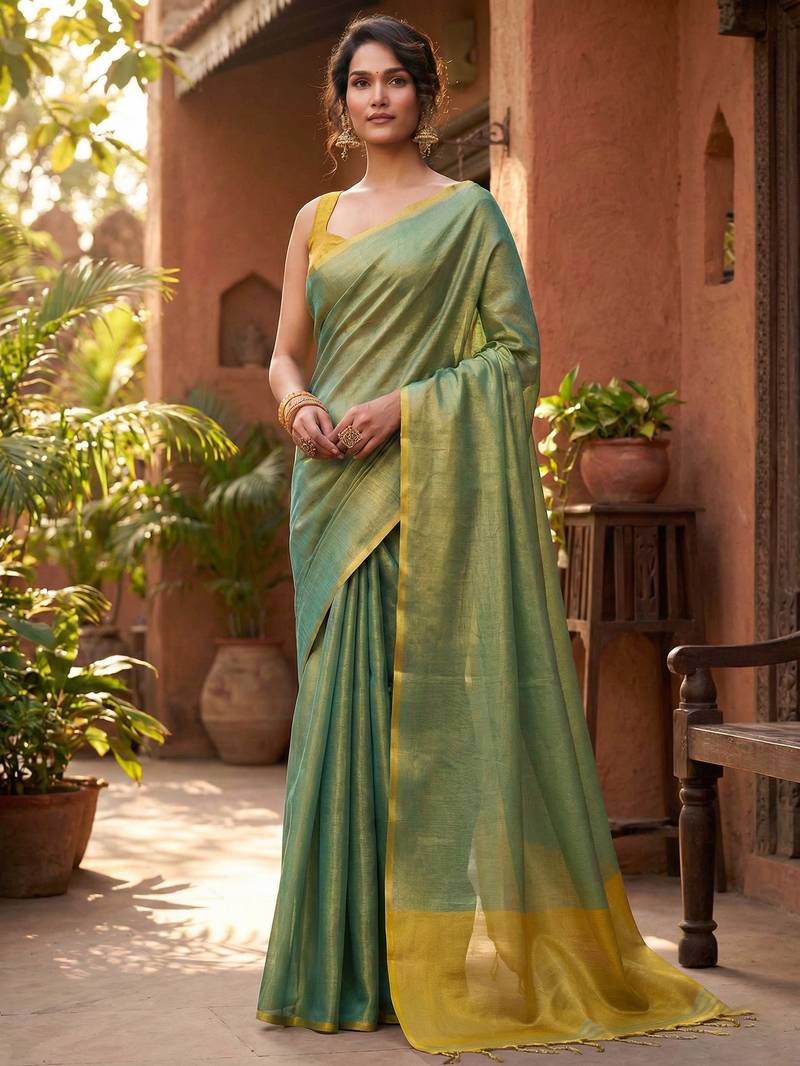 teal green & gold-toned solid tissue silk blend saree with zari border