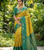 yellow soft silk blend saree with green nandi zari border