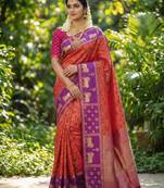rust orange soft silk blend saree with purple nandi zari border