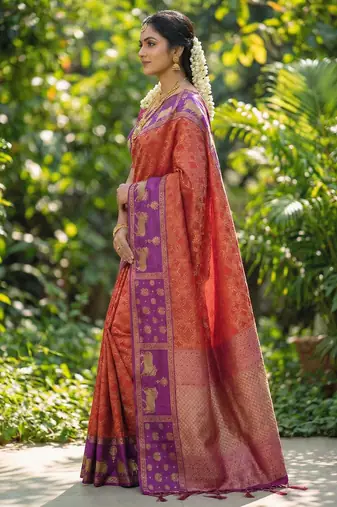 rust orange soft silk blend saree with purple nandi zari border