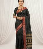 the midnight luxurious black soft silk blend saree with magenta & gold zari border
