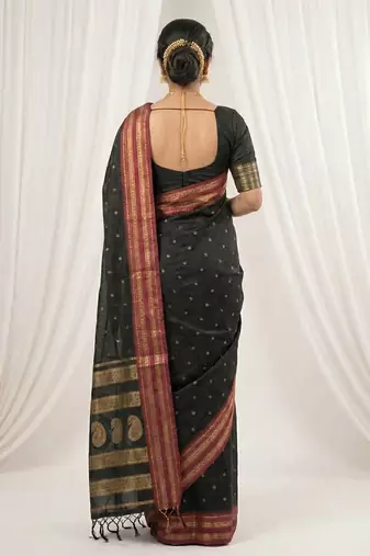 the midnight luxurious black soft silk blend saree with magenta & gold zari border