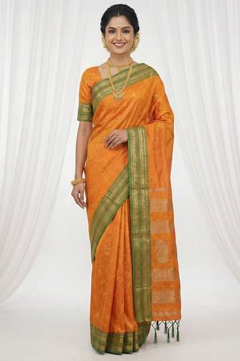 the sunset glow: vibrant orange soft silk blend saree with contrast green zari border