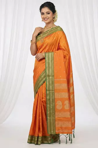 the sunset glow: vibrant orange soft silk blend saree with contrast green zari border