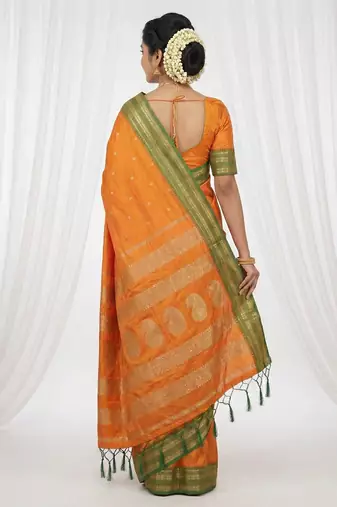the sunset glow: vibrant orange soft silk blend saree with contrast green zari border