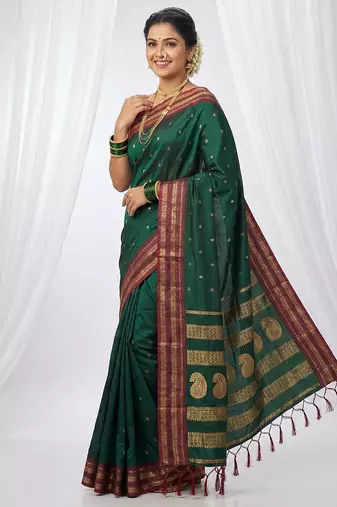 the emerald empress: dark green soft silk blend saree with rich crimson red zari border
