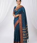 the peacock hue: teal blue soft silk blend saree with contrast red zari border