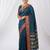 the peacock hue: teal blue soft silk blend saree with contrast red zari border