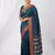 the peacock hue: teal blue soft silk blend saree with contrast red zari border