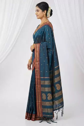 the peacock hue: teal blue soft silk blend saree with contrast red zari border