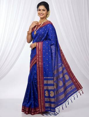 the peacock hue: blue soft silk blend saree with contrast red zari border 1