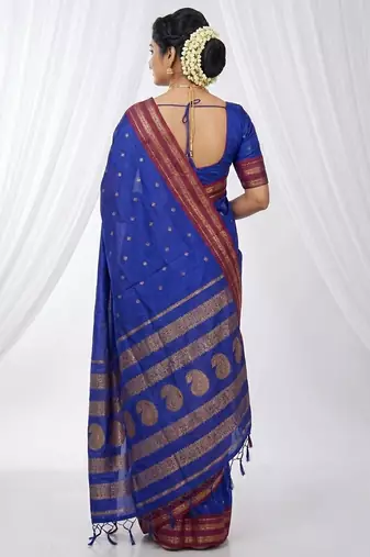 the peacock hue: blue soft silk blend saree with contrast red zari border