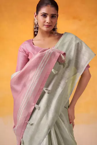 mint green & pink solid tissue linen saree with zari border