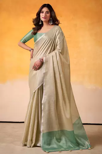 beige & sea green solid tissue linen saree with zari border
