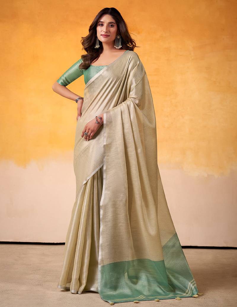 beige & sea green solid tissue linen saree with zari border