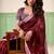 Women maroon woven design linen saree with silver zari