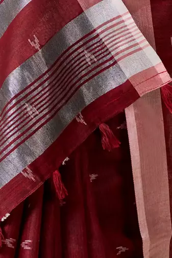 Women maroon woven design linen saree with silver zari