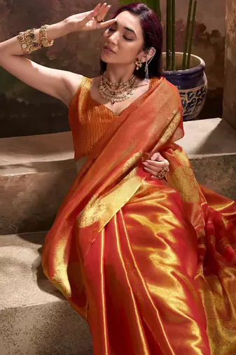 rust orange woven tissue silk blend saree with mandala motifs