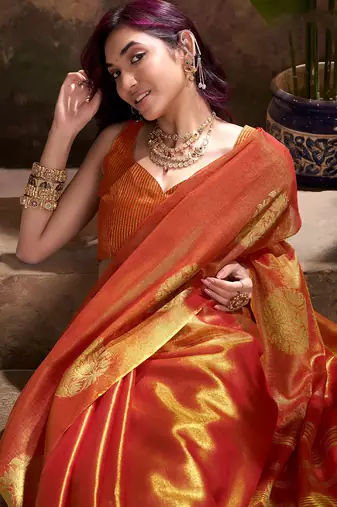 rust orange woven tissue silk blend saree with mandala motifs