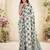 Women sage green & grey checked linen saree with floral pallu
