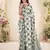 Women sage green & grey checked linen saree with floral pallu