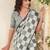 Women sage green & grey checked linen saree with floral pallu