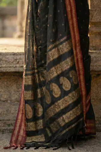 The midnight luxurious black soft silk blend saree with magenta & gold zari border