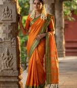 The sunset glow: vibrant orange soft silk saree with contrast green zari border