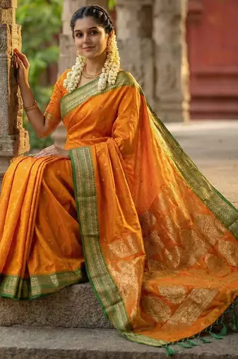 The sunset glow: vibrant orange soft silk blend saree with contrast green zari border