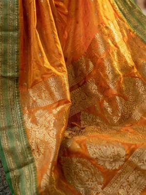The sunset glow: vibrant orange soft silk blend saree with contrast green zari border 4