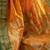 The sunset glow: vibrant orange soft silk saree with contrast green zari border