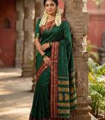 The emerald empress: dark green soft silk saree with rich crimson red zari border