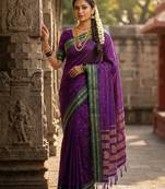 The peacock hue: violet soft silk saree with contrast green zari border