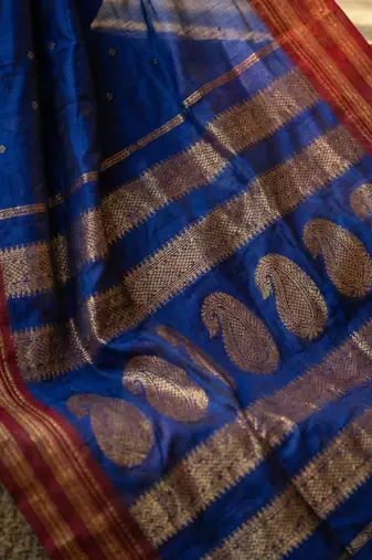 The peacock hue: blue soft silk blend saree with contrast red zari border
