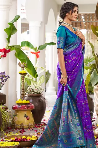 Royal purple banarasi silk blend saree with teal blue contrast border & zari work