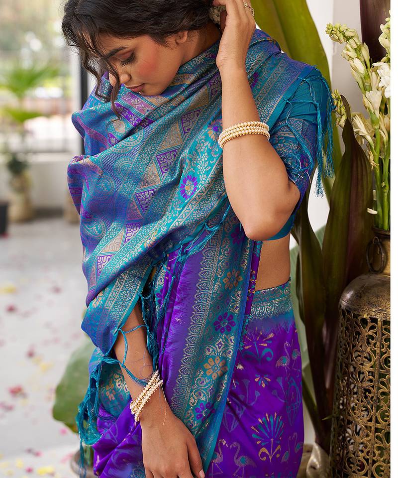 Royal purple banarasi silk blend saree with teal blue contrast border & zari work