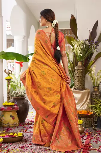 Bright orange banarasi silk blend saree with red border for wedding & festive wear