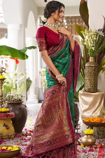 Emerald green banarasi silk blend saree with maroon border & gold zari weaving