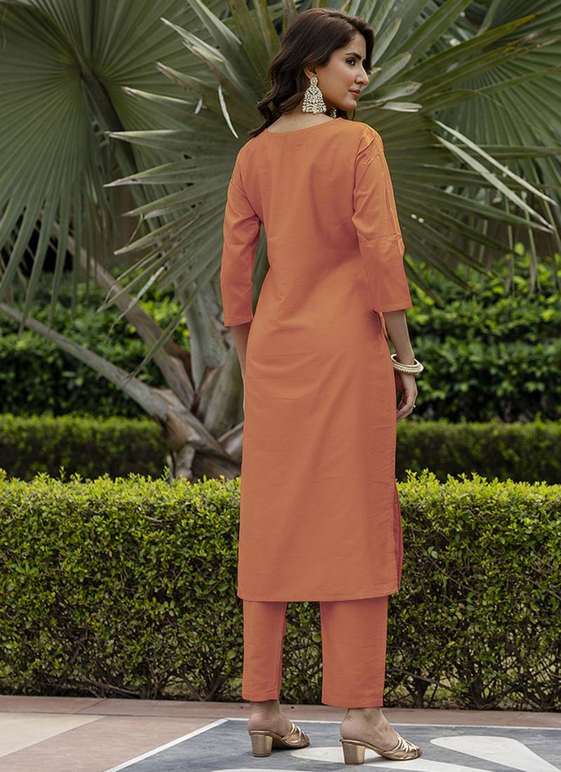Orange color rayon sttiched straight suit