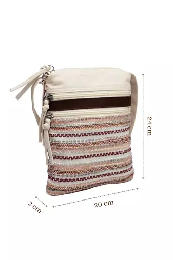pink canvas sling bag with striped pattern