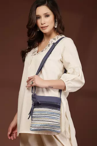 blue acrylic sling bag with striped pattern