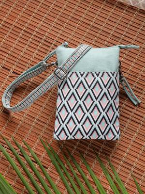 teal canvas sling bag with geometric print 1