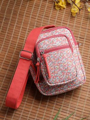 red canvas sling bag with floral print 1