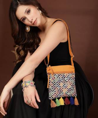 mustard canvas sling bag with geometric design 3