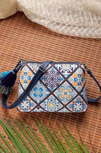 blue canvas sling bag with geometric print